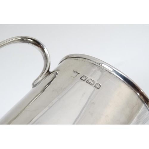 540 - A silver Christening mug / tankard  with loop handle. Hallmarked Sheffield 1917 maker Fenton Brother... 