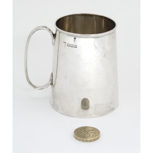 540 - A silver Christening mug / tankard  with loop handle. Hallmarked Sheffield 1917 maker Fenton Brother... 