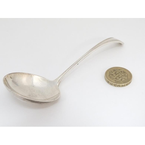 543 - A silver sauce ladle with feather edge handle hallmarked Birmingham 1966 maker  Joseph Gloster Ltd. ... 