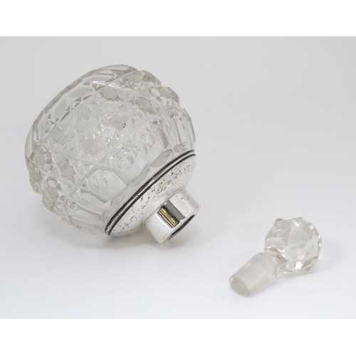 545 - A cut glass scent bottle of spherical form with silver mount and collar. the whole 5'' high