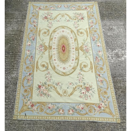 55 - Carpet / Rug: an Aubusson woollen carpet in light sage ground with light blue border, and various go... 