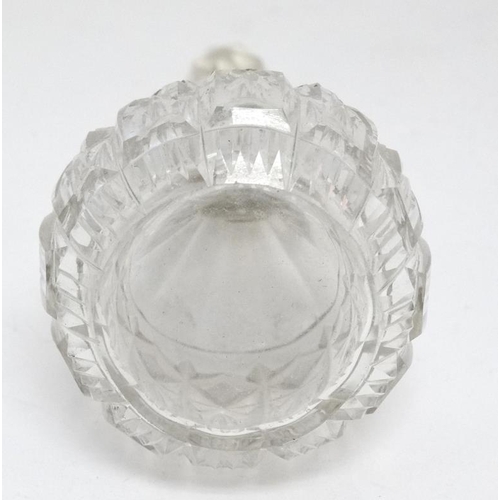 551 - A cut glass scent bottle with silver collar hallmarked London 1926. The whole 5 1/2'' high