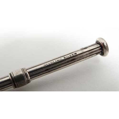 557 - Sampson Mordan : A Sterling silver retractable tooth pick marked S Mordan & Co. 2'' long (closed)