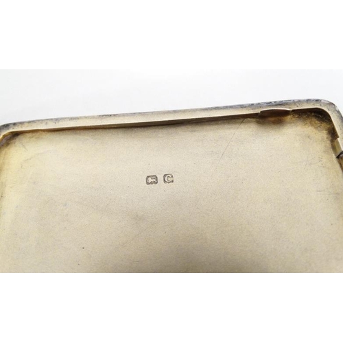 560 - A silver cigarette case with engine turned decoration. Hallmarked Birmingham 1927 maker Adie Bros Lt... 