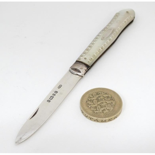 561 - A Victorian silver folding fruit knife with mother of pearl handle. Hallmarked Sheffield 1874  maker... 