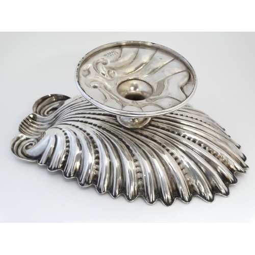 566 - A silver pate tazza / pedestal bowl formed as a scallop shell 11 3/4'' wide x 4'' high