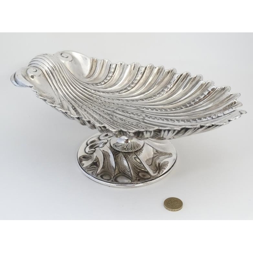 566 - A silver pate tazza / pedestal bowl formed as a scallop shell 11 3/4'' wide x 4'' high