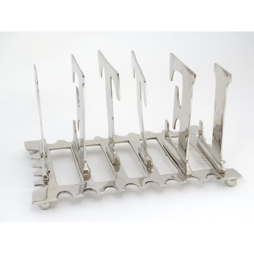 581 - An early 21st 6 bar letter rack, the bars formed as letters spelling 'LETTER'  8'' long x 5 1/2'' wi... 