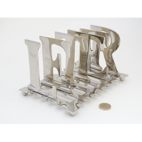 581 - An early 21st 6 bar letter rack, the bars formed as letters spelling 'LETTER'  8'' long x 5 1/2'' wi... 