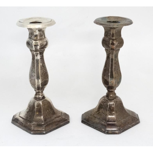 582 - A pair of silver plated candlesticks  7'' high