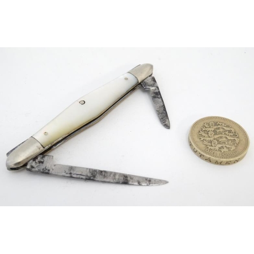 583 - A late 19thC / early 20thC twin handled pen knife with mother of pearl and silver plated handle 3'' ... 