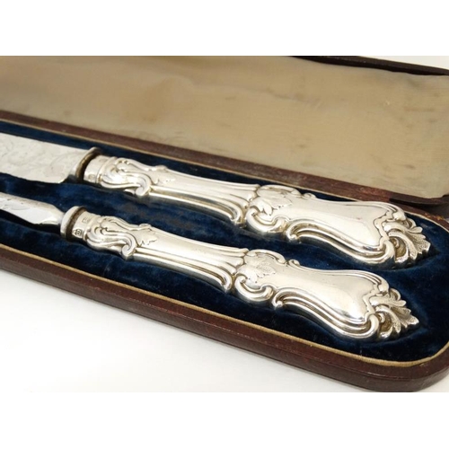 587 - A Victorian silver and close plate carving set comprising knife and fork within a  Moroccan leather ... 