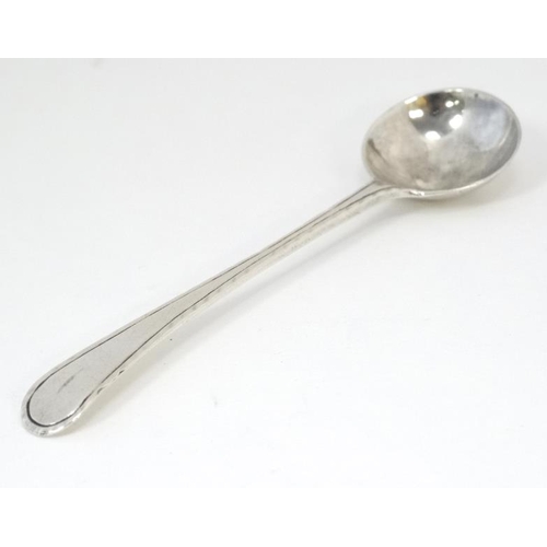 588 - A 19thC Old English pattern silver salt spoon with feather edge. 4'' long (8g)