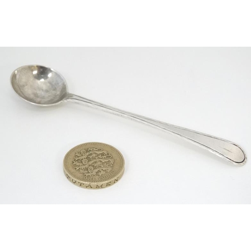 588 - A 19thC Old English pattern silver salt spoon with feather edge. 4'' long (8g)