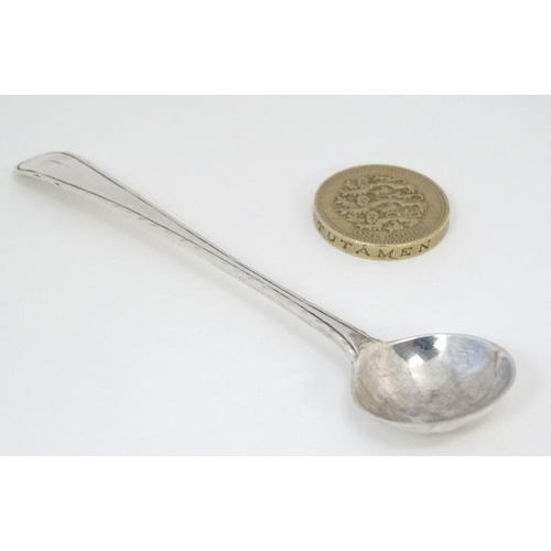 588 - A 19thC Old English pattern silver salt spoon with feather edge. 4'' long (8g)