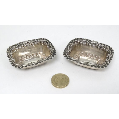 588A - A pair of Victorian silver salts with embossed decoration hallmarked Birmingham 1898 maker  William ... 