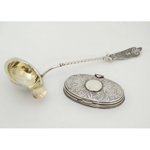 592 - A white metal ladle with gilded bowl together with a Victorian silver oval box hallmarked London 198... 