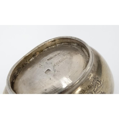 593 - A white metal pepperette and salt in the Chinese Export style with engraved dragon decoration Indist... 