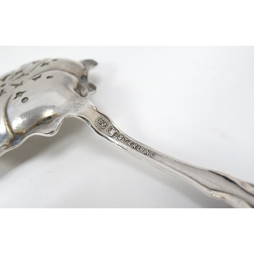 594 - A Canadian Sterling silver sifiter spoon 5'' long