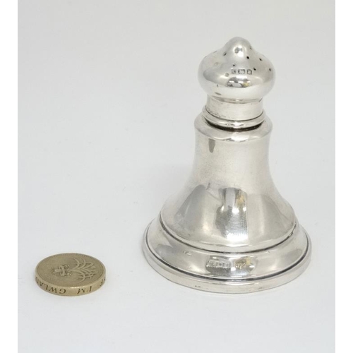 599 - A silver pepperette hallmarked London 1924 maker JE. 3'' high