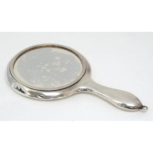 601 - A small silver hand mirror hallmarked Birmingham 1913 maker Crisford & Norris 4 1/4'' high