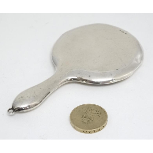 601 - A small silver hand mirror hallmarked Birmingham 1913 maker Crisford & Norris 4 1/4'' high