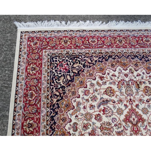 61 - Carpet / Rug :A beige ground Keshan style carpet measuring 63 1/2 x 96 1/2''