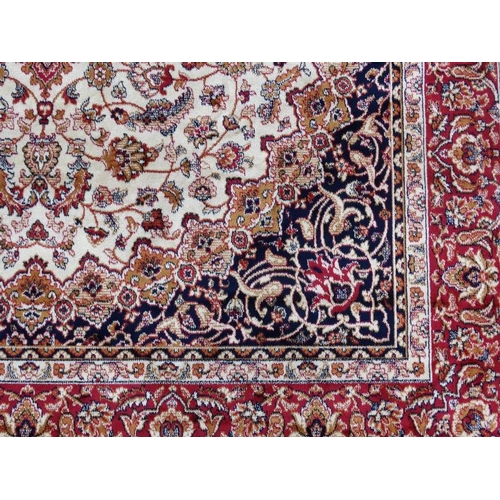 61 - Carpet / Rug :A beige ground Keshan style carpet measuring 63 1/2 x 96 1/2''