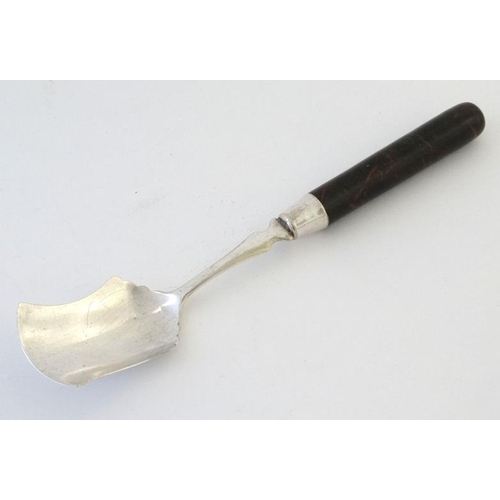 613 - A silver plated preserve spoon with hardstone handle. 7'' long