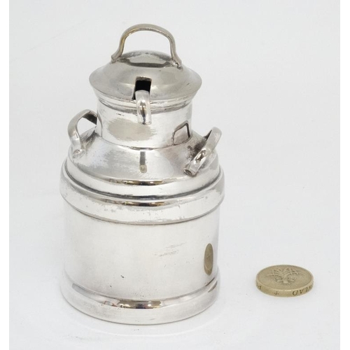 614 - A novelty silver plate small cream pot formed as a churn with ladle. The whole approx 4 1/2'' high