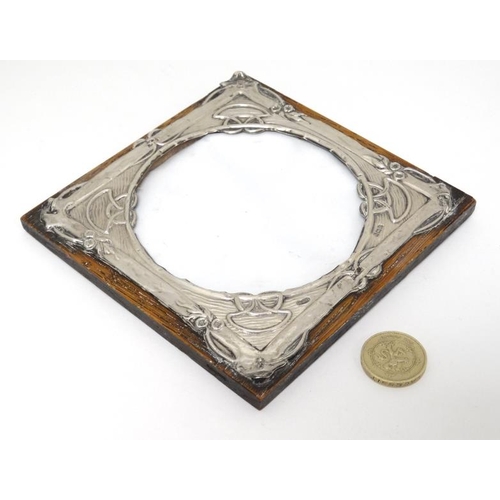 619 - A photograph frame with silver surround, Hallmarked Birmingham 1904 maker Henry Charles Freeman. The... 