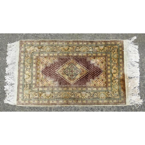 62 - Carpet / Rug:  A Turkish Silk  Prayer Rug  with sage green , yellow, black, brown and buff colours e... 