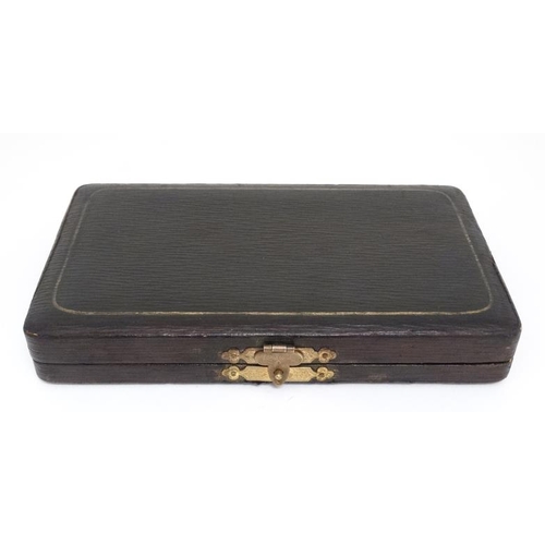 620 - Cased manicure items to include mother of pearl files, silver plate scissors etc. The case 7'' wide