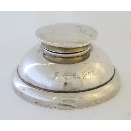 630 - A silver capstan formed inkwell hallmarked Birmingham 1950 maker Sanders & Mackenzie. the base 4 3/4... 