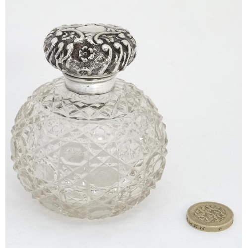 640 - A cut glass scent bottle of spherical form with silver top hallmarked Birmingham 1899 maker  Arthur ... 