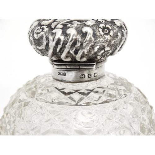 640 - A cut glass scent bottle of spherical form with silver top hallmarked Birmingham 1899 maker  Arthur ... 