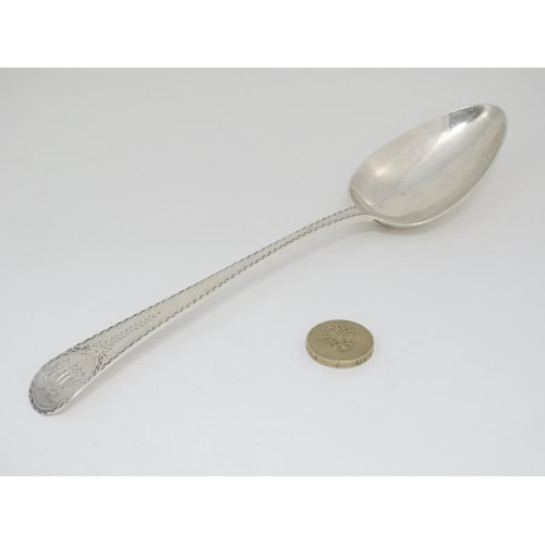 641 - A rare Old English Pattern table spoon with bright cut decoration. Hallmarked London 1785 with Incus... 