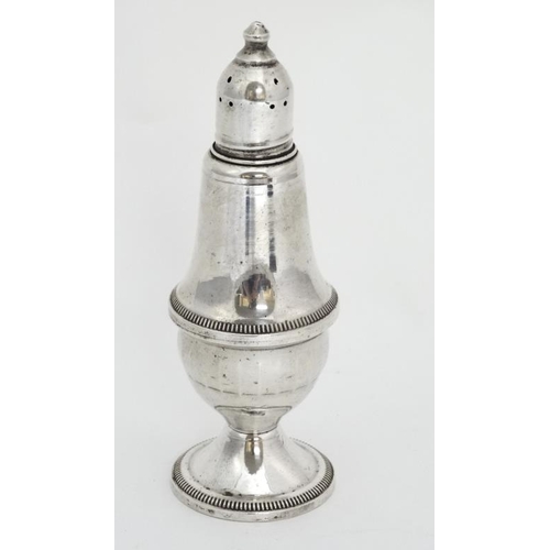 644 - A peppertette with glass lining and weighted base marked under 'Sterling Weighted by Duchin' 5 1/4''... 