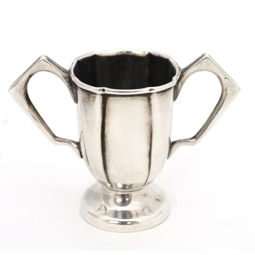 647 - A twin handled miniature trophy cup hallmarked Birmingham 1915 maker William Hutton & Sons Ltd. 2'' ... 