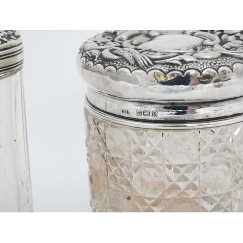 652 - A cut glass dressing table pot of cylindrical form with silver lid hallmarked Birmingham 1909 maker ... 