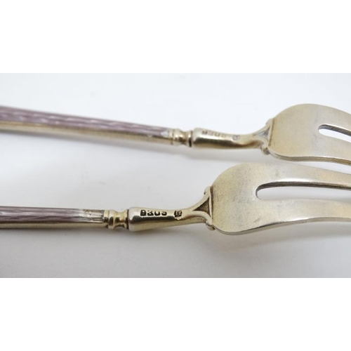 654 - Scandinavian silver : 4 (2+2) silver pickle forks with green and lilac enamel decorated handles.