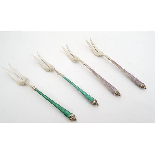 654 - Scandinavian silver : 4 (2+2) silver pickle forks with green and lilac enamel decorated handles.