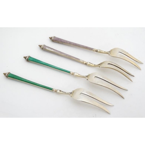 654 - Scandinavian silver : 4 (2+2) silver pickle forks with green and lilac enamel decorated handles.