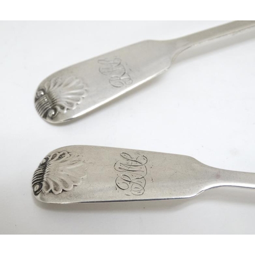 657 - A pair of silver fiddle and shell pattern teaspoons hallmarked Newcastle 1861 maker Thomas Sewell 5 ... 