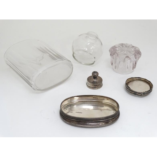 659 - 3 assorted glass dressing table pots with late 19thC / early 20thC silver tops (3)