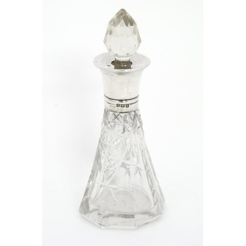 665 - A cut glass scent bottle with silver collar hallmarked Birmingham 1917 4'' high