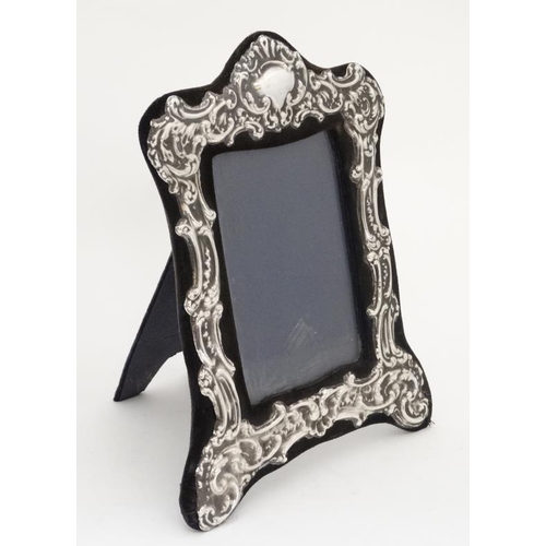 666 - An easel / strut photograph frame with silver border hallmarked London 1978 maker 8 1/4'' high overa... 