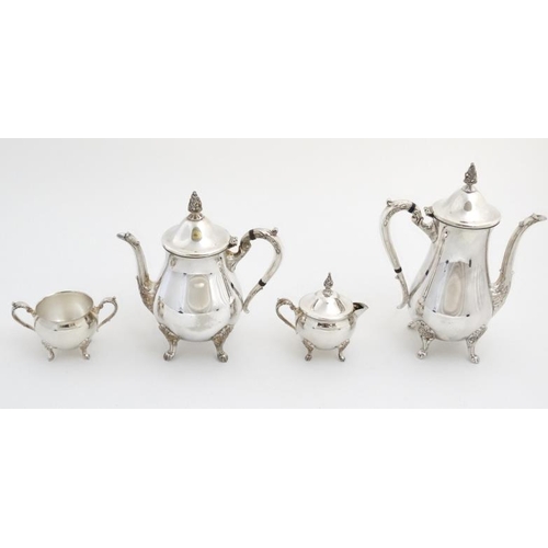 669 - A four piece silver plate coffee set comprising coffee pot, hot water pot, sugar and milk jug