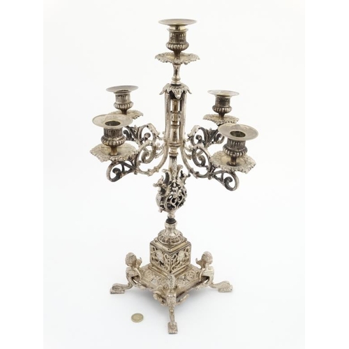 671 - A late 19thC / early 20thC silver plated 5-branch table candleabrum / candleabara. Approx 20'' high