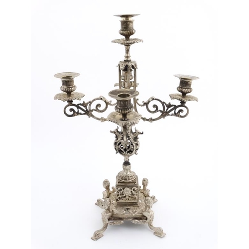 671 - A late 19thC / early 20thC silver plated 5-branch table candleabrum / candleabara. Approx 20'' high